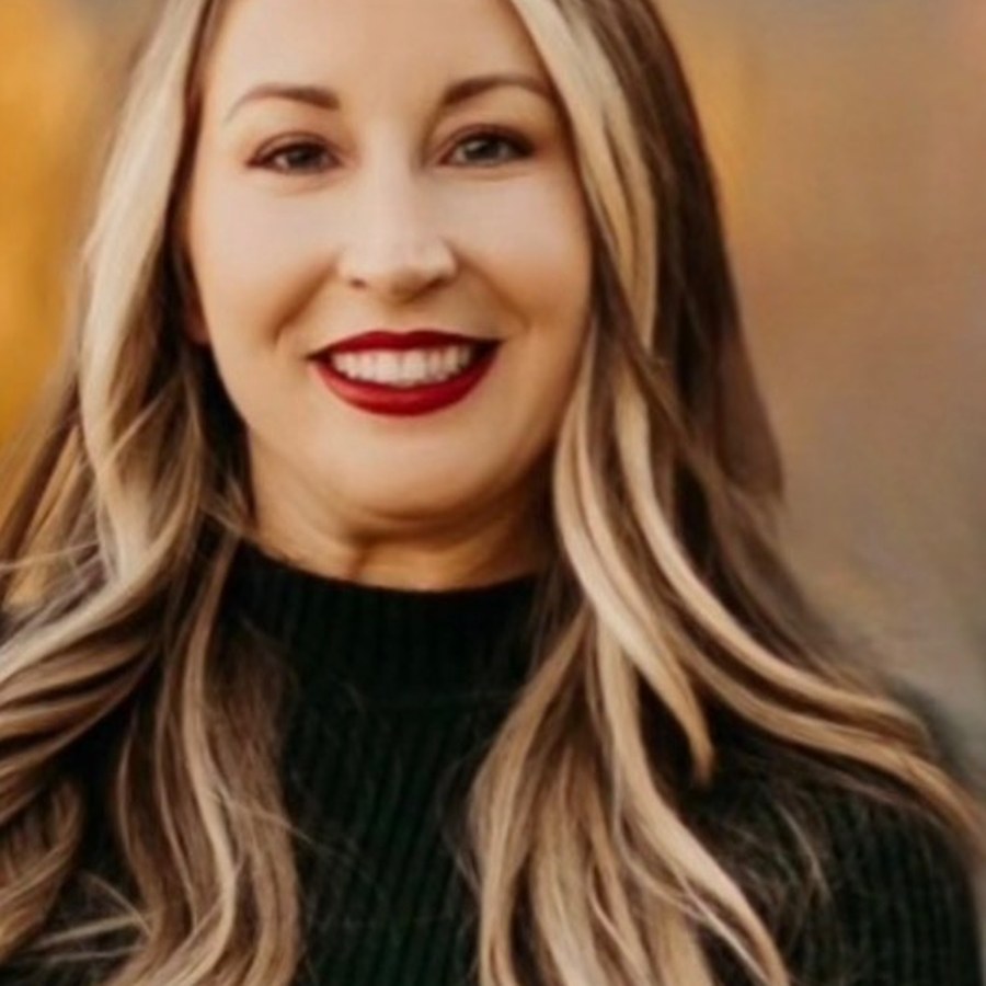 Kyla smiling, wearing a black sweater